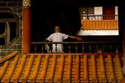 Monk in the shadow : Kunming, China